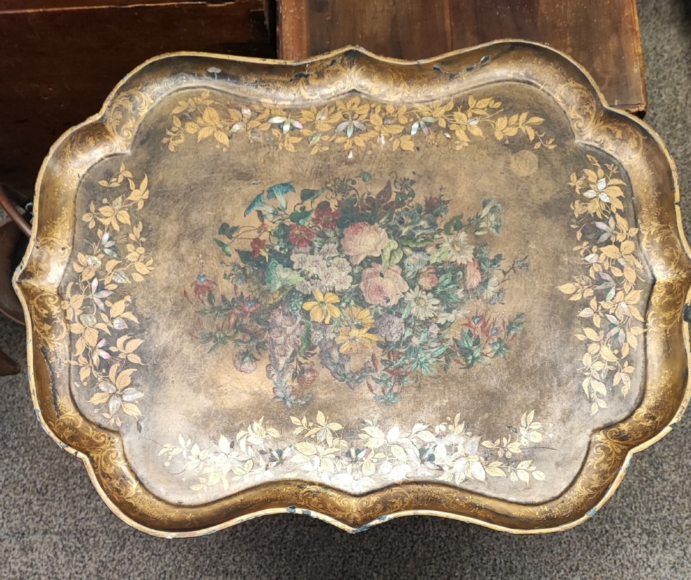 A large Regency gold lacquer and mother of pearl inlaid paper mache tray