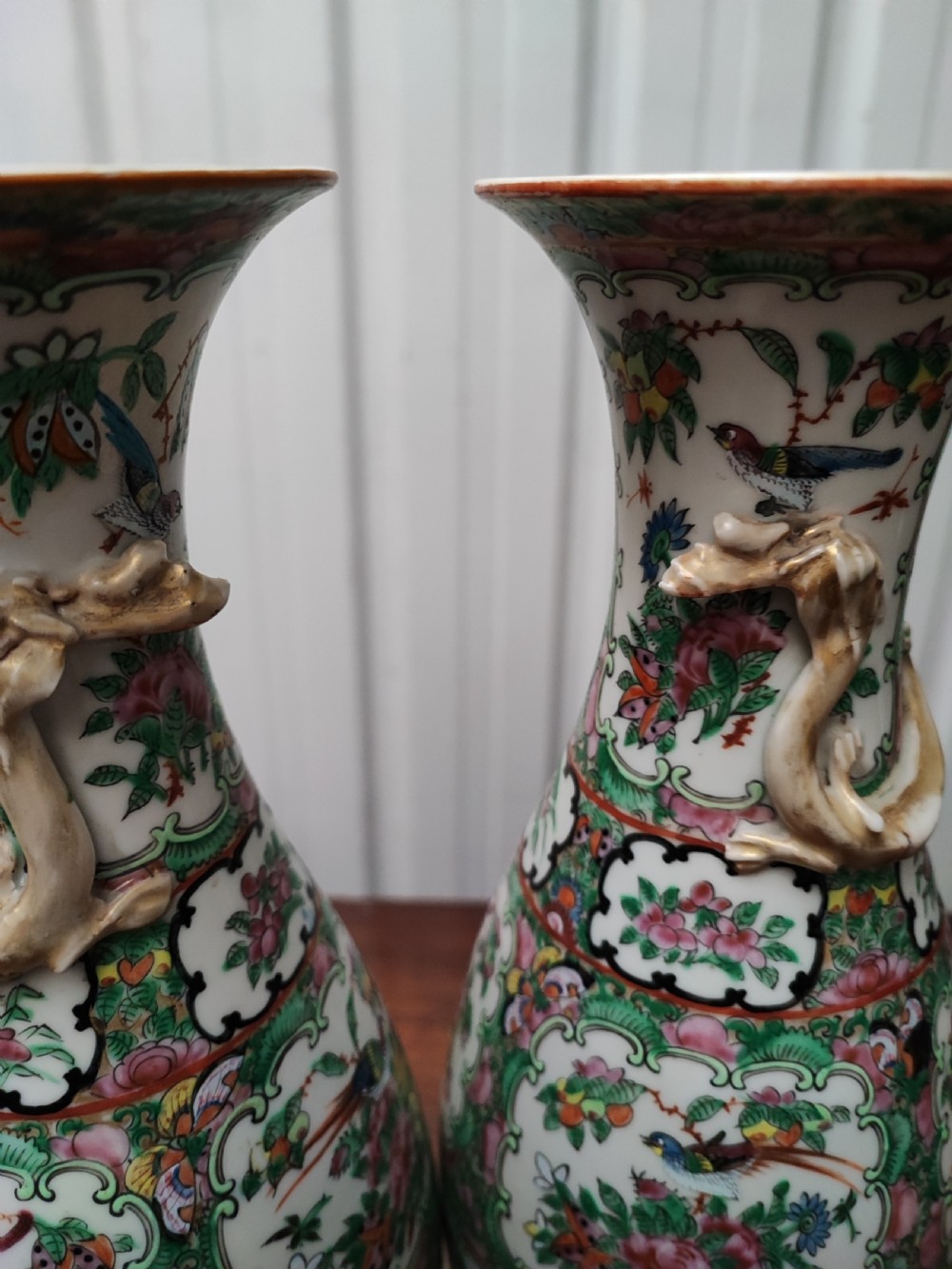 An antique pair of chinese  Famille Rose vases. View II