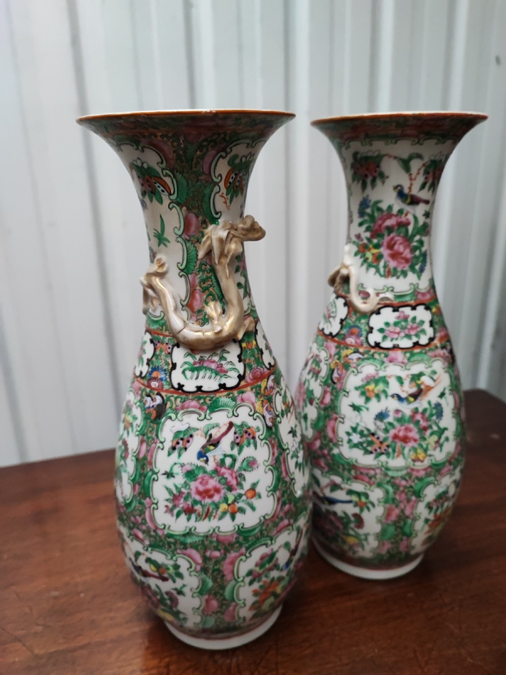 An antique pair of chinese  Famille Rose vases. View X