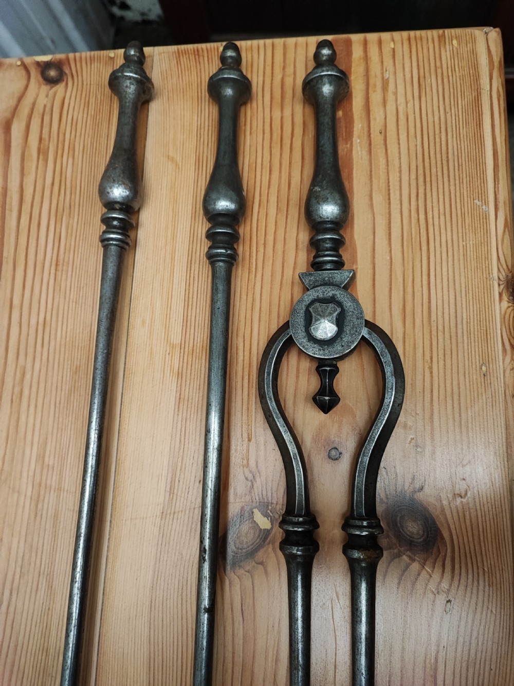 A fine set of Regency steel fire irons View II