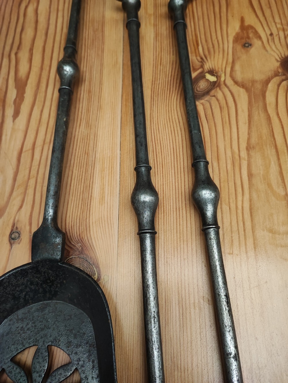 A fine set of Regency steel fire irons View VIII