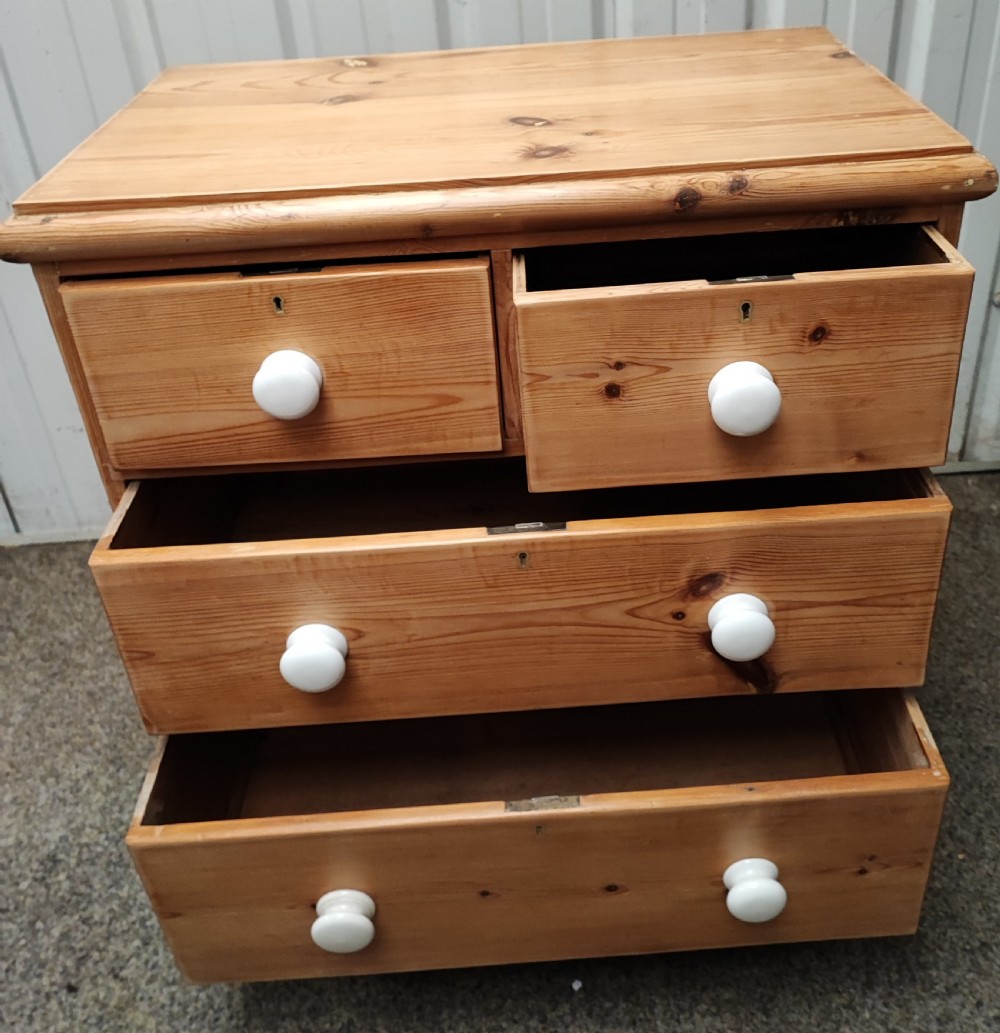 A Victorian pine chest of drawers. View V