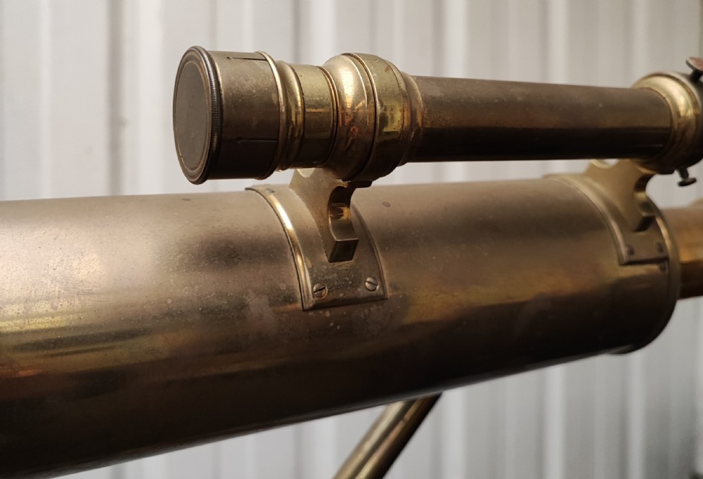 A good and large antique brass telescope on original tripod stand. View VIII