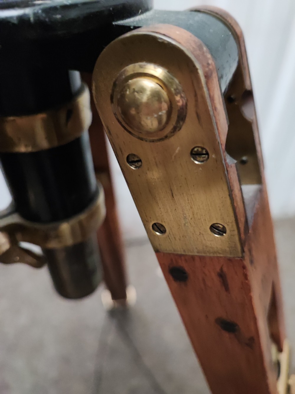 A good and large antique brass telescope on original tripod stand. View X