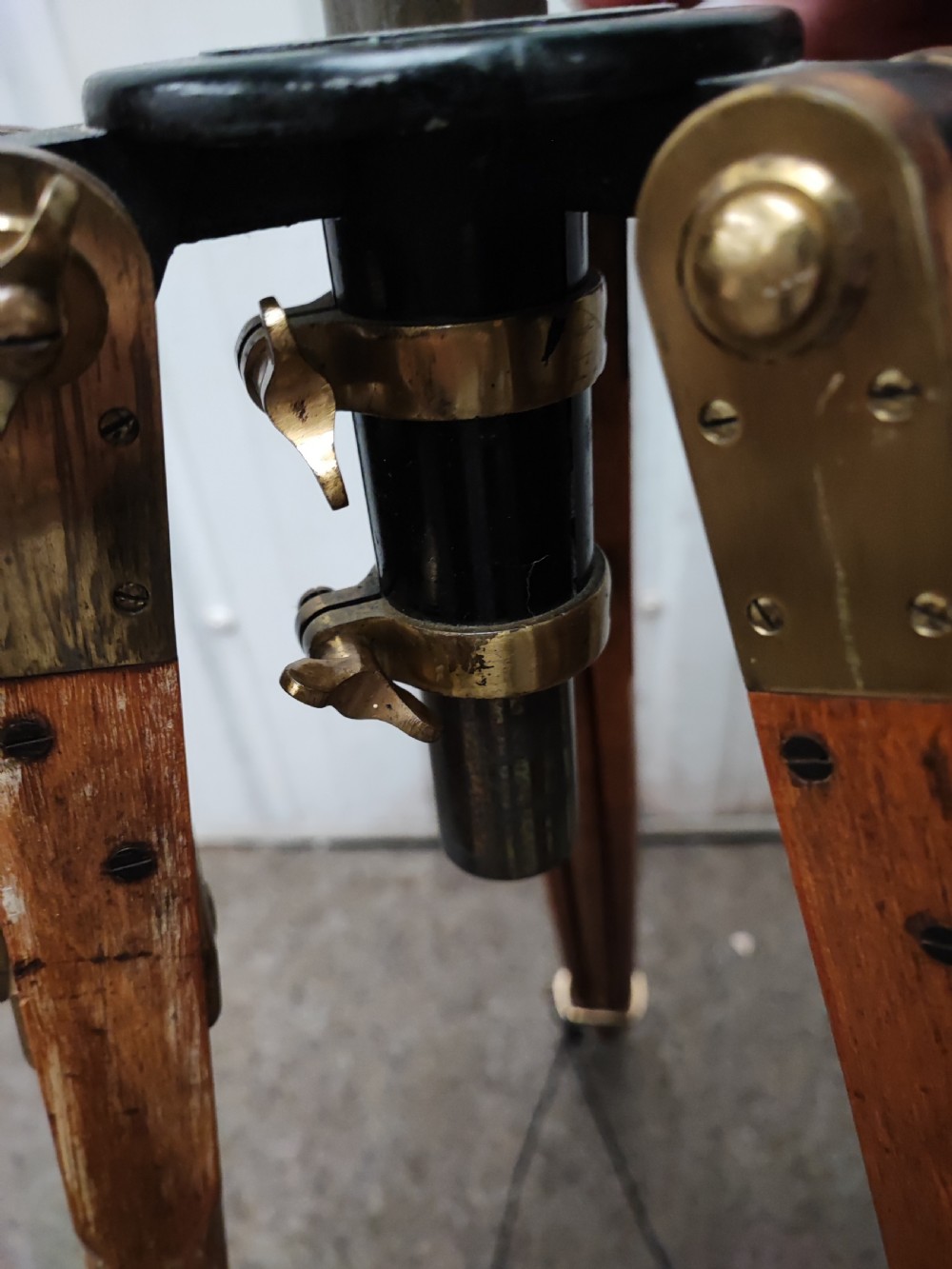 A good and large antique brass telescope on original tripod stand. View XXIII