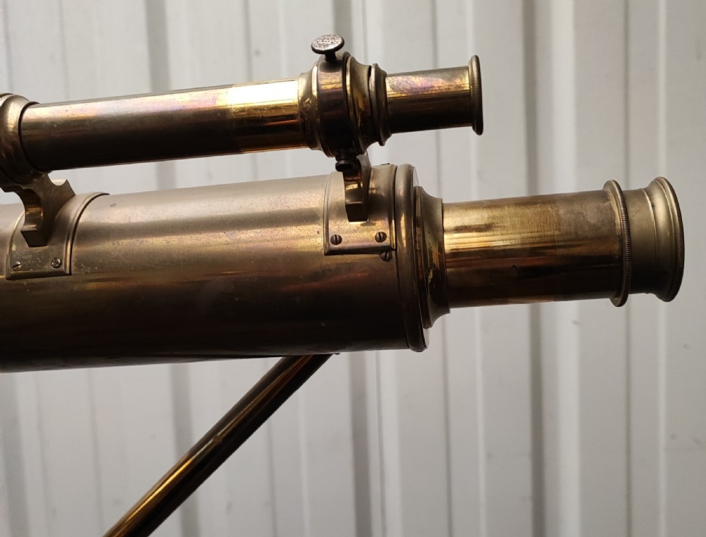 A good and large antique brass telescope on original tripod stand. View XXV
