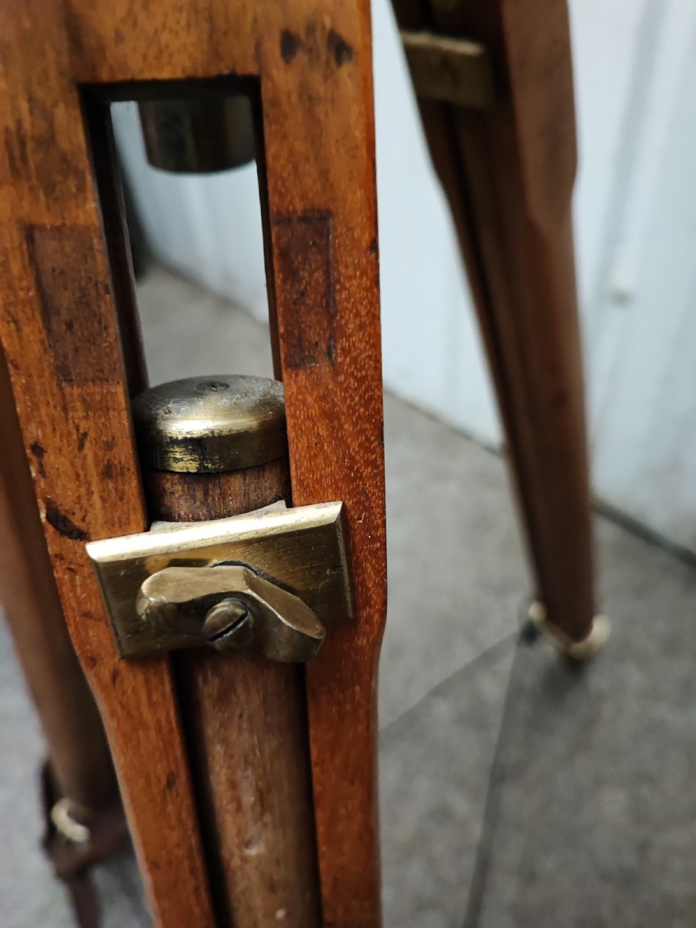 A good and large antique brass telescope on original tripod stand. View XXVI