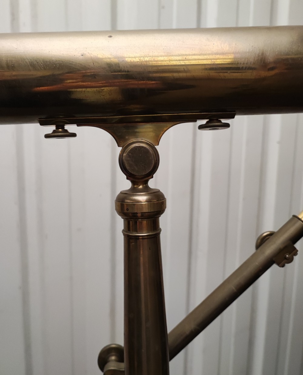 A good and large antique brass telescope on original tripod stand. View XXIX