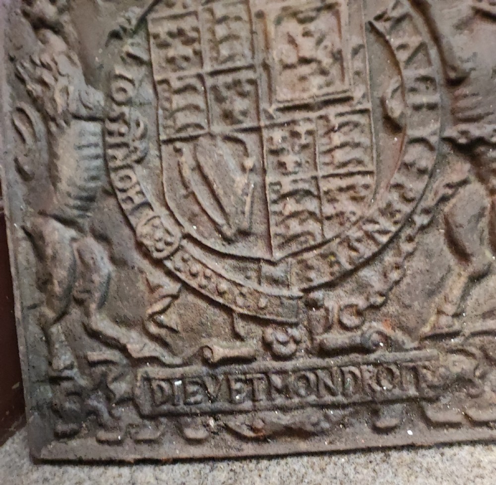 Antique cast iron royal military crested fire back. View X