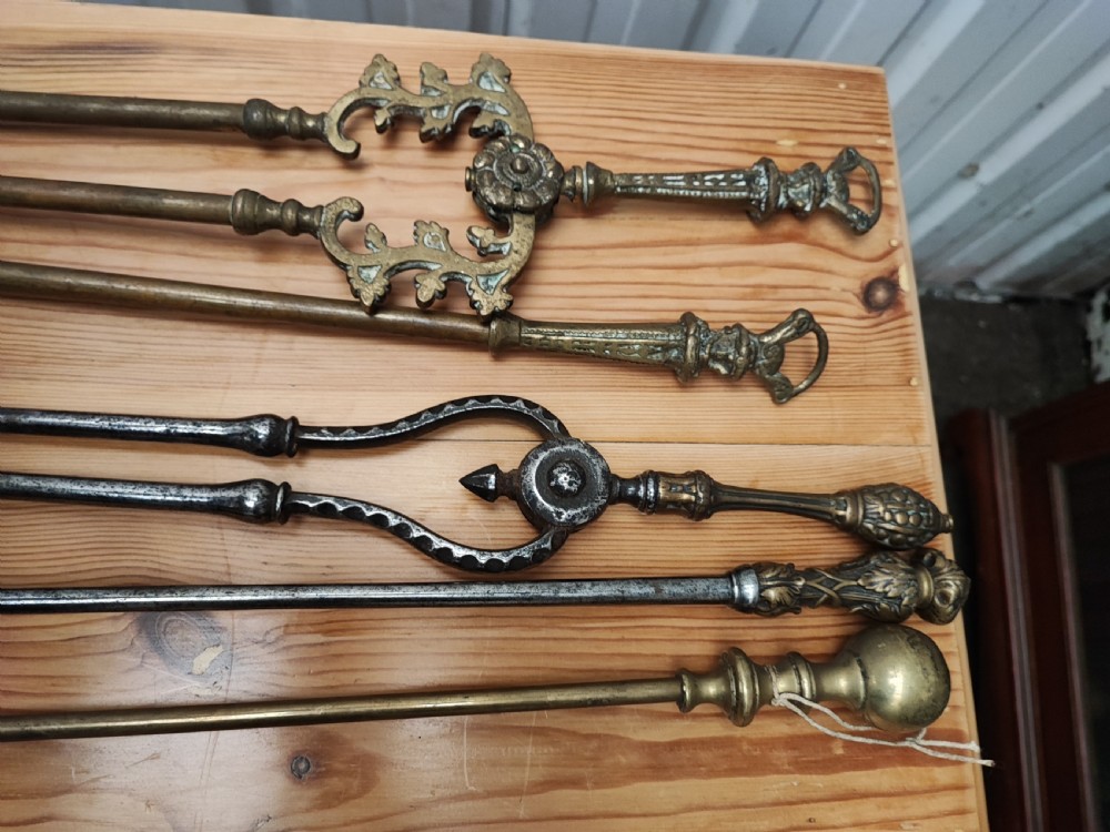 A Regency brass and steel collection of fire irons View II