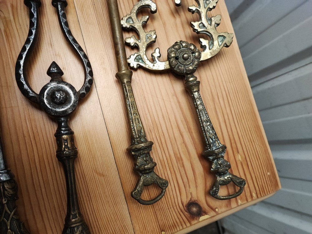 A Regency brass and steel collection of fire irons View IV