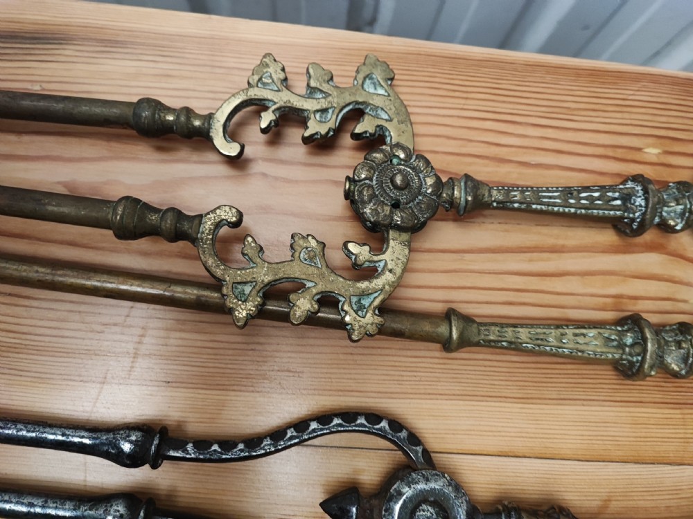 A Regency brass and steel collection of fire irons View V