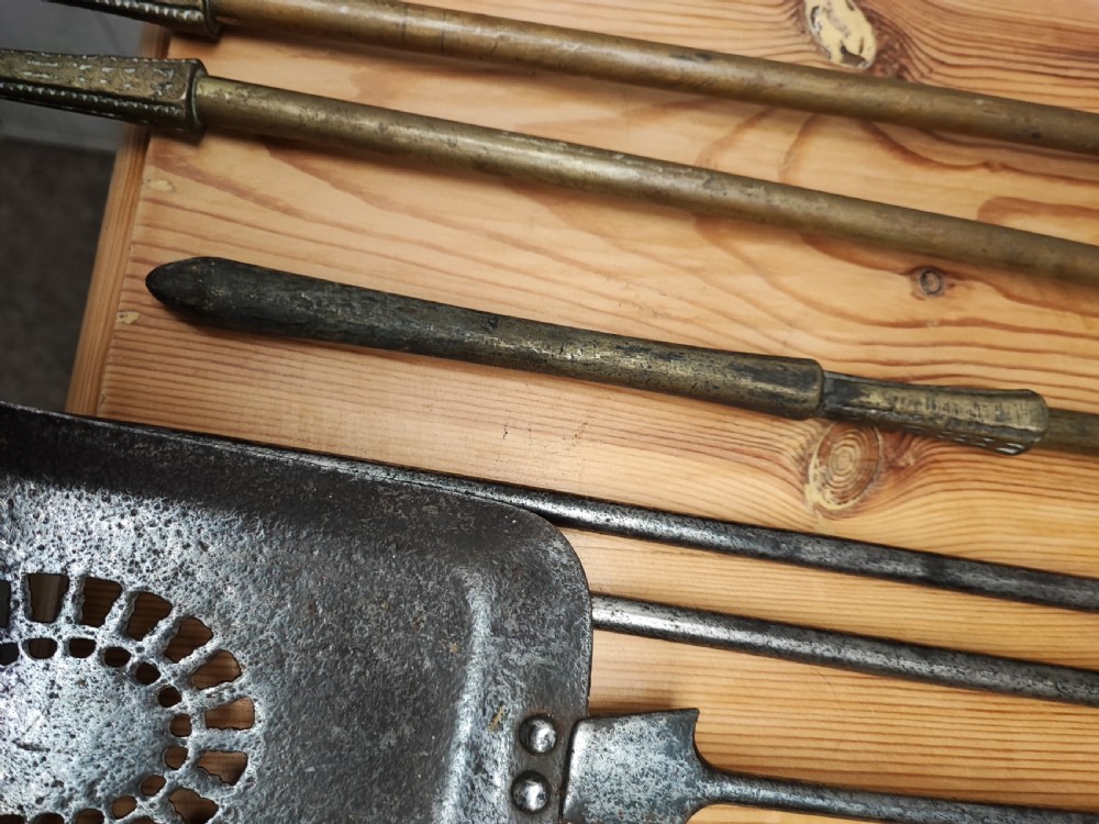 A Regency brass and steel collection of fire irons View VI