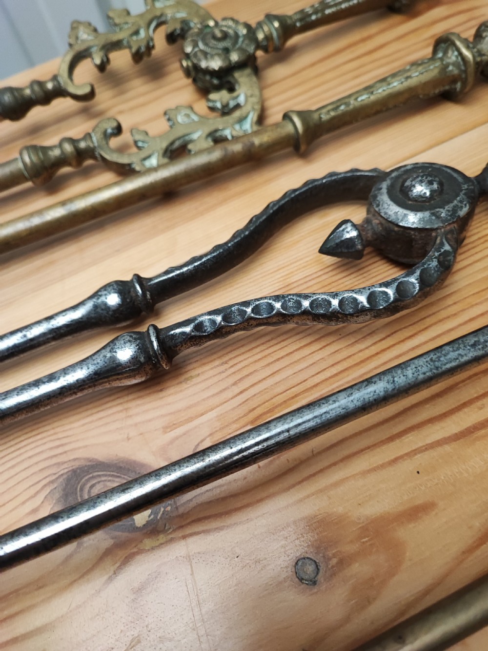 A Regency brass and steel collection of fire irons View IX