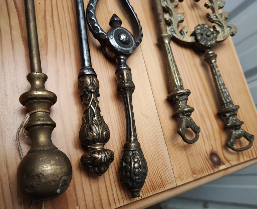A Regency brass and steel collection of fire irons View XVI