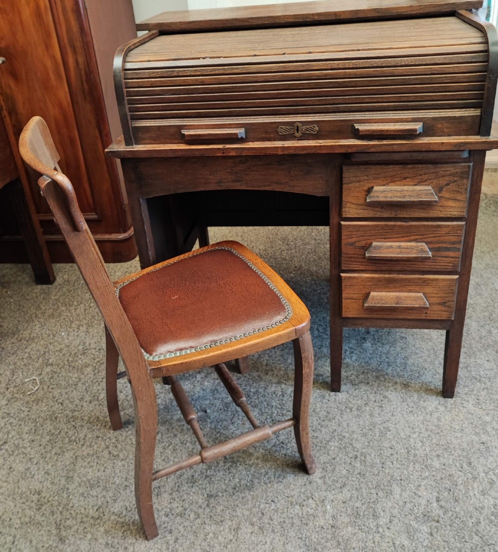 An antique oak roll top desk and chair  View IV