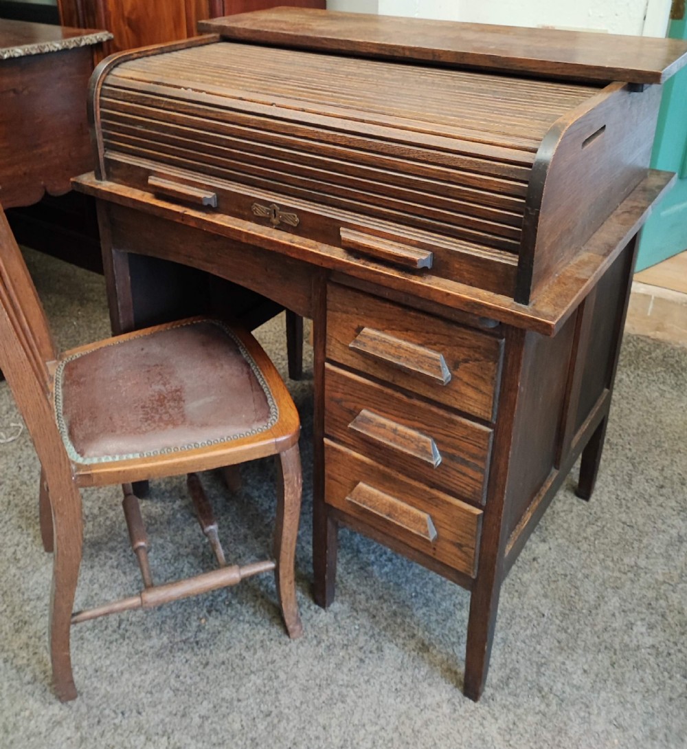 An antique oak roll top desk and chair  View V