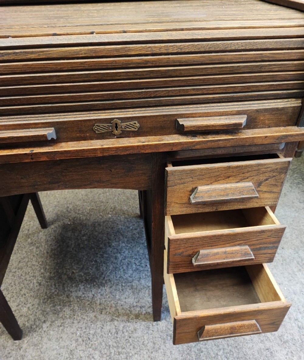 An antique oak roll top desk and chair  View VI