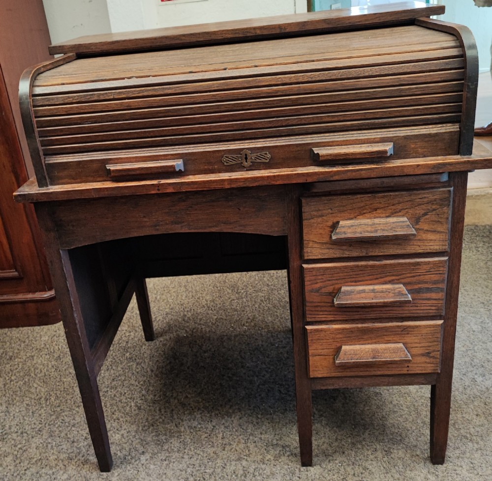 An antique oak roll top desk and chair  View VII