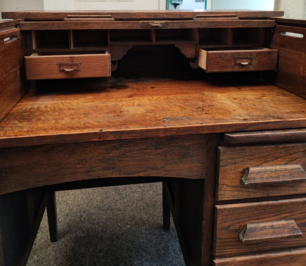 An antique oak roll top desk and chair  View XVI