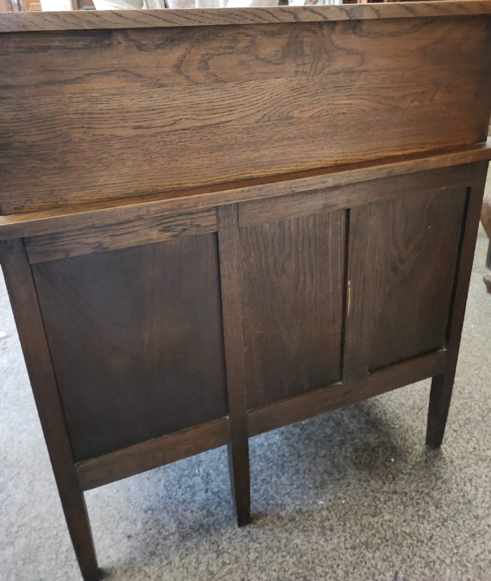 An antique oak roll top desk and chair  View XVIII