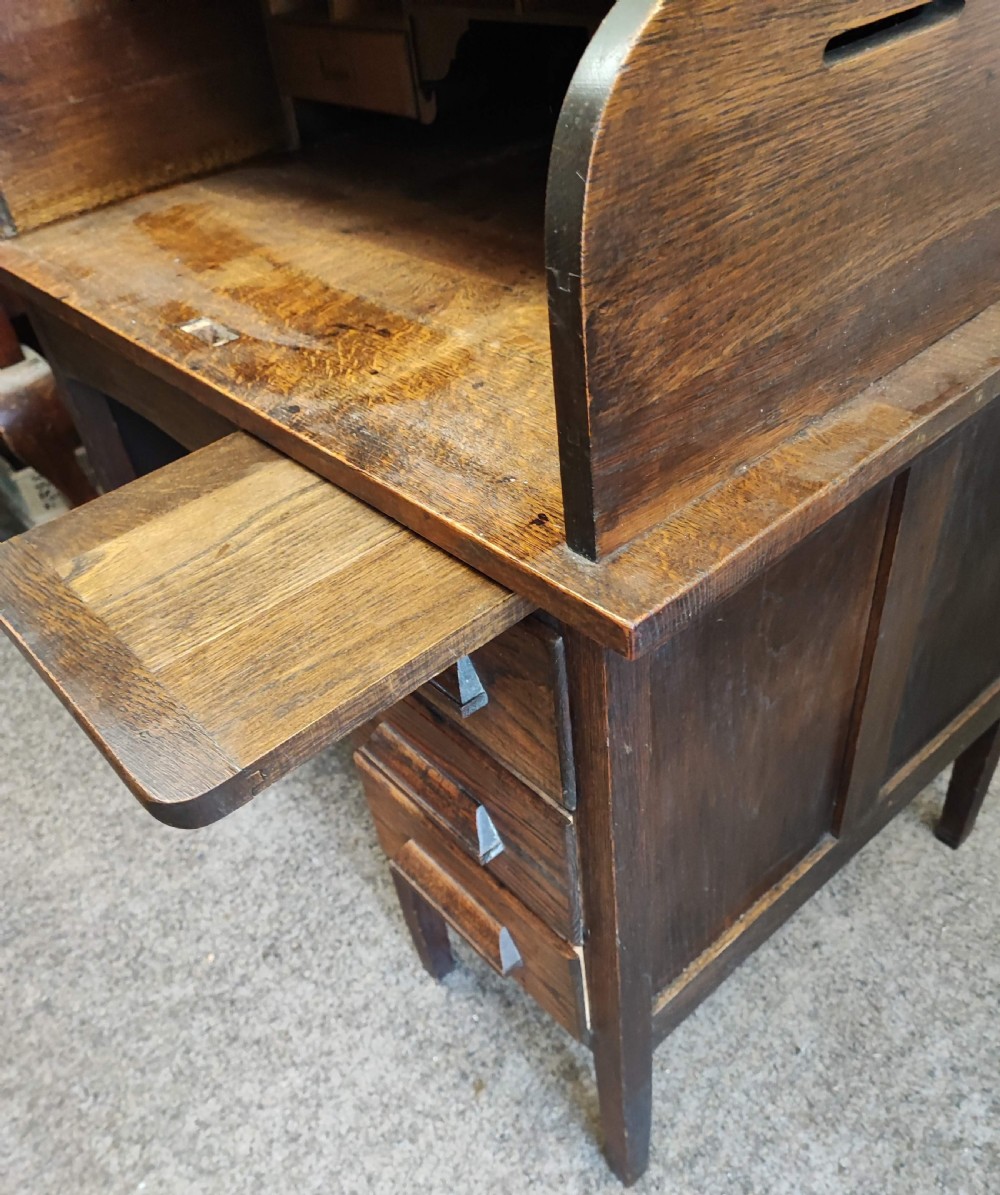 An antique oak roll top desk and chair  View XIX