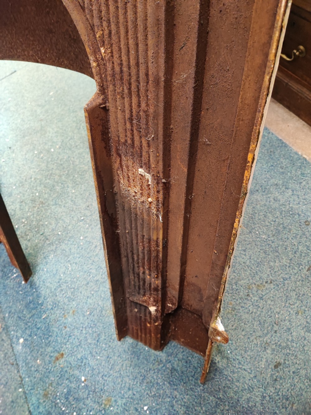 A Victorian cast iron fire surround View II