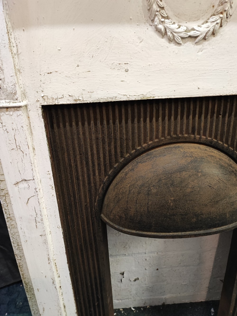 A Victorian cast iron fire surround View X