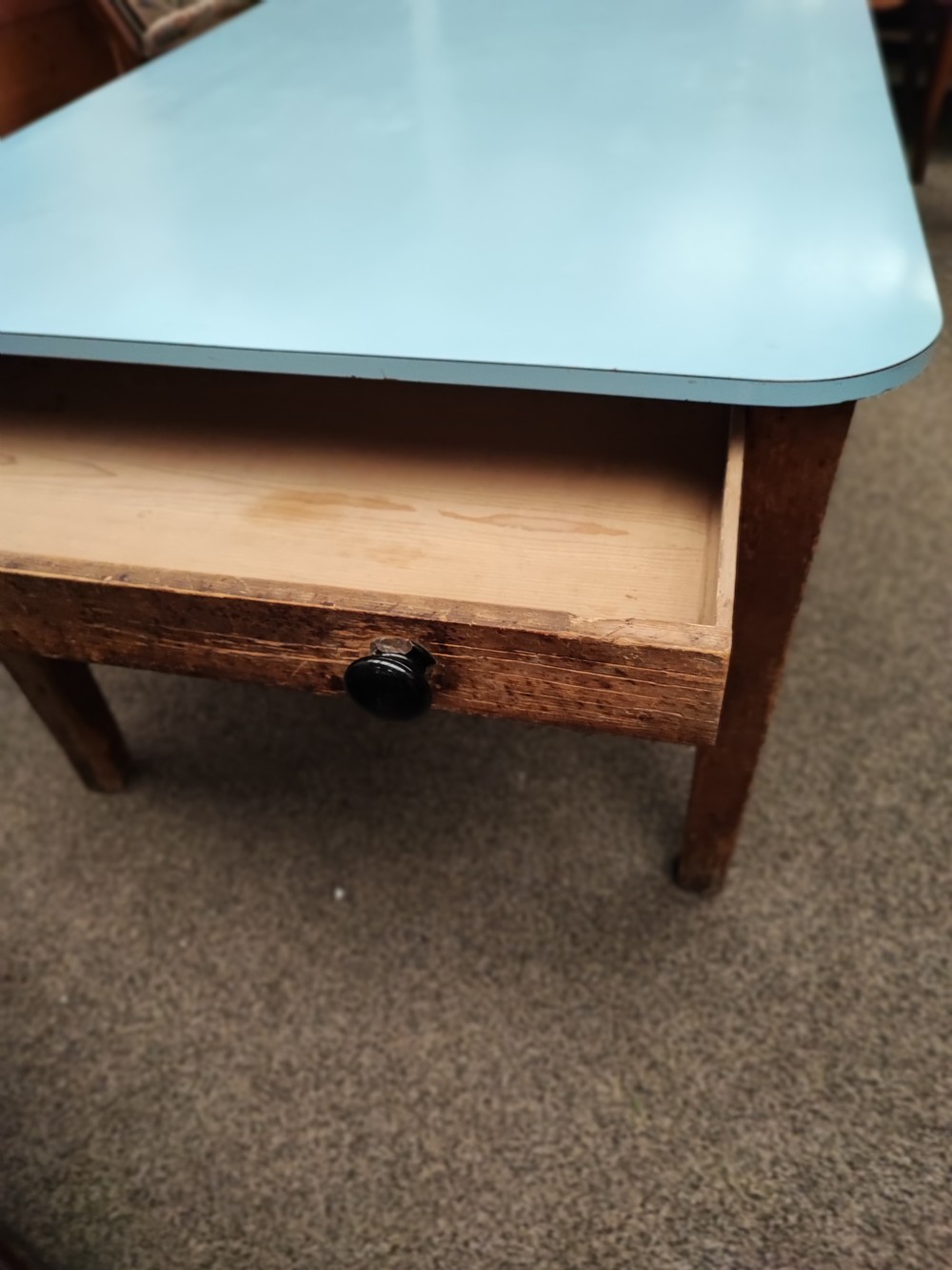 An antique pine kitchen table with duck egg blue Formica top. View V