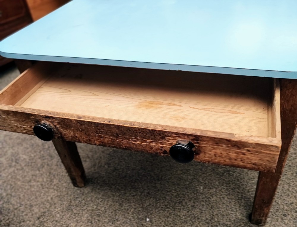 An antique pine kitchen table with duck egg blue Formica top. View IX
