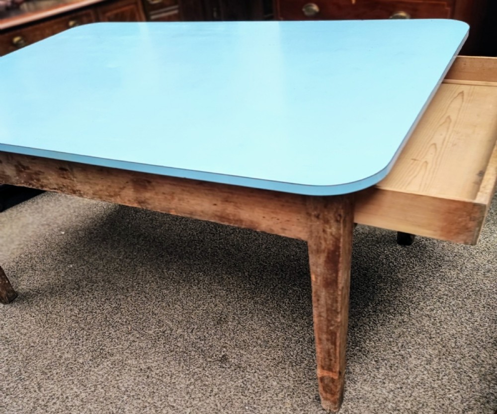 An antique pine kitchen table with duck egg blue Formica top. View X