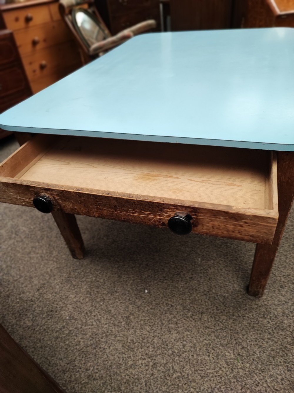 An antique pine kitchen table with duck egg blue Formica top. View XI