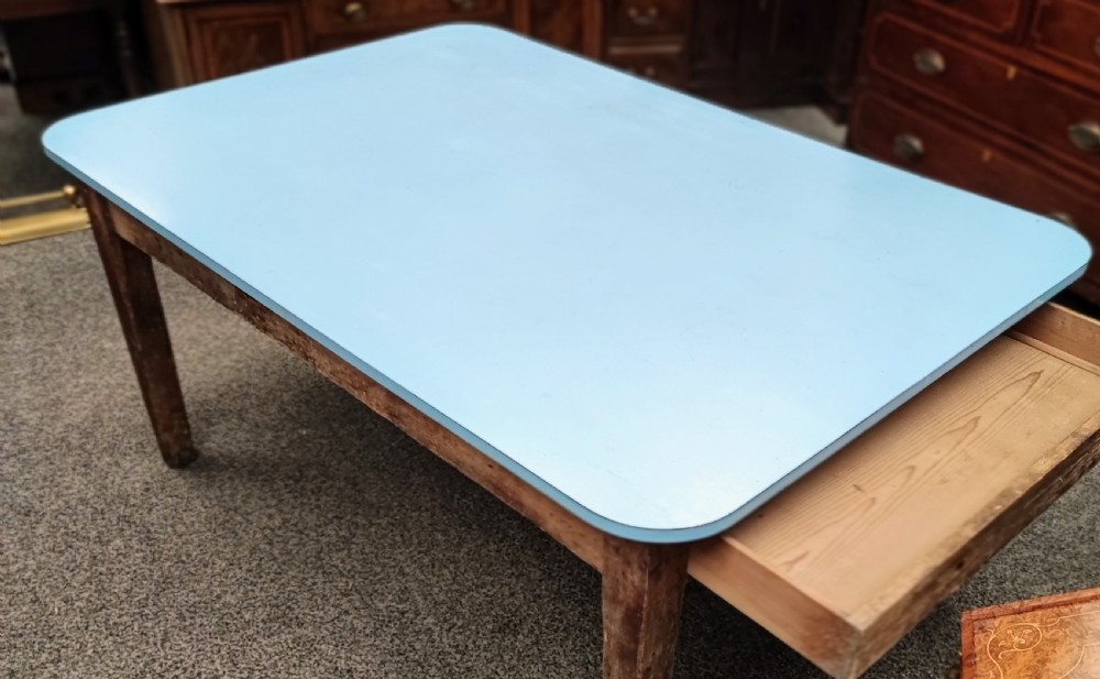 An antique pine kitchen table with duck egg blue Formica top. View XII