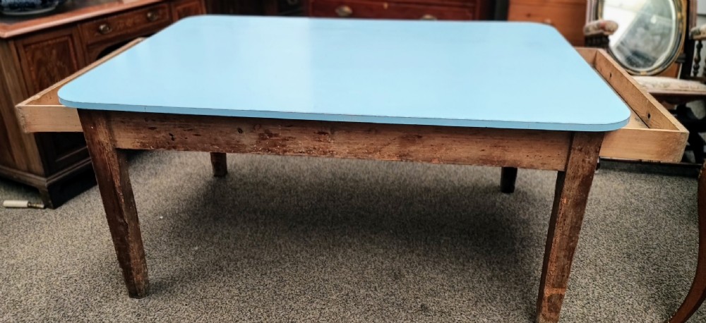 An antique pine kitchen table with duck egg blue Formica top. View XIV