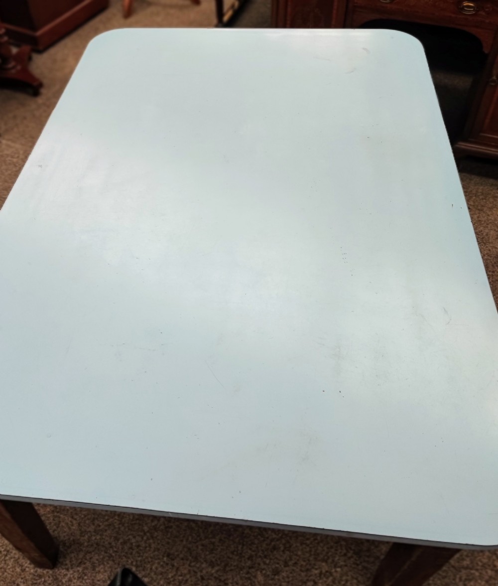 An antique pine kitchen table with duck egg blue Formica top. View XVII