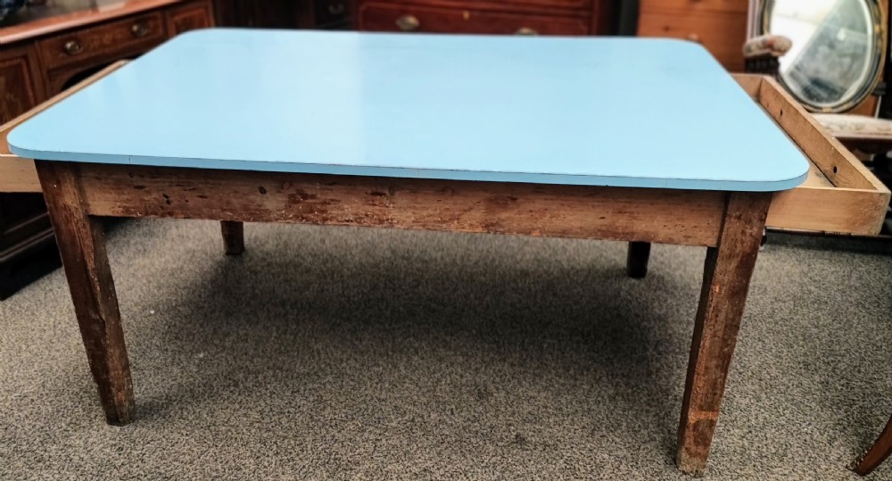 An antique pine kitchen table with duck egg blue Formica top. View XXI