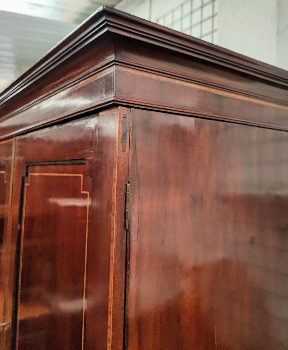 Good Regency inlaid linen press. View XVI