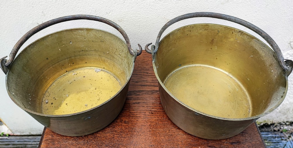 Antique matched pair of brass jam pans.