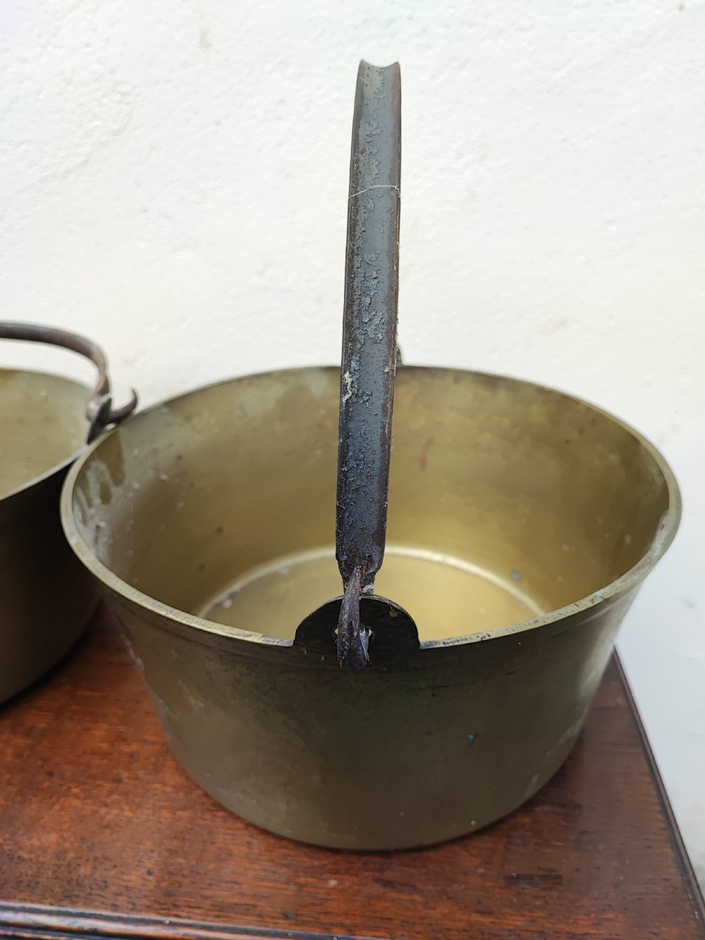 Antique matched pair of brass jam pans. View V