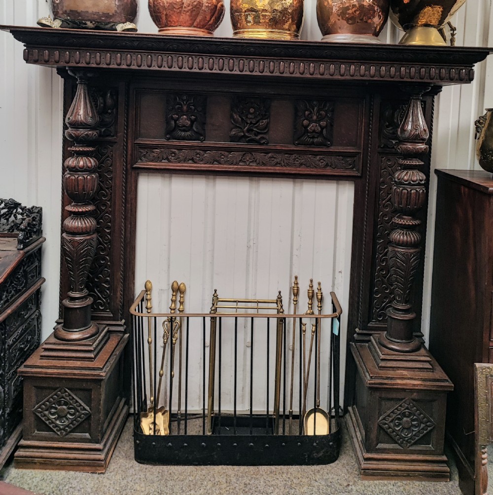 Impressive antique carved oak fire surround.