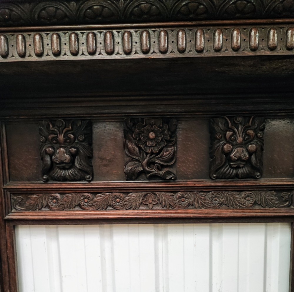 Impressive antique carved oak fire surround. View IV