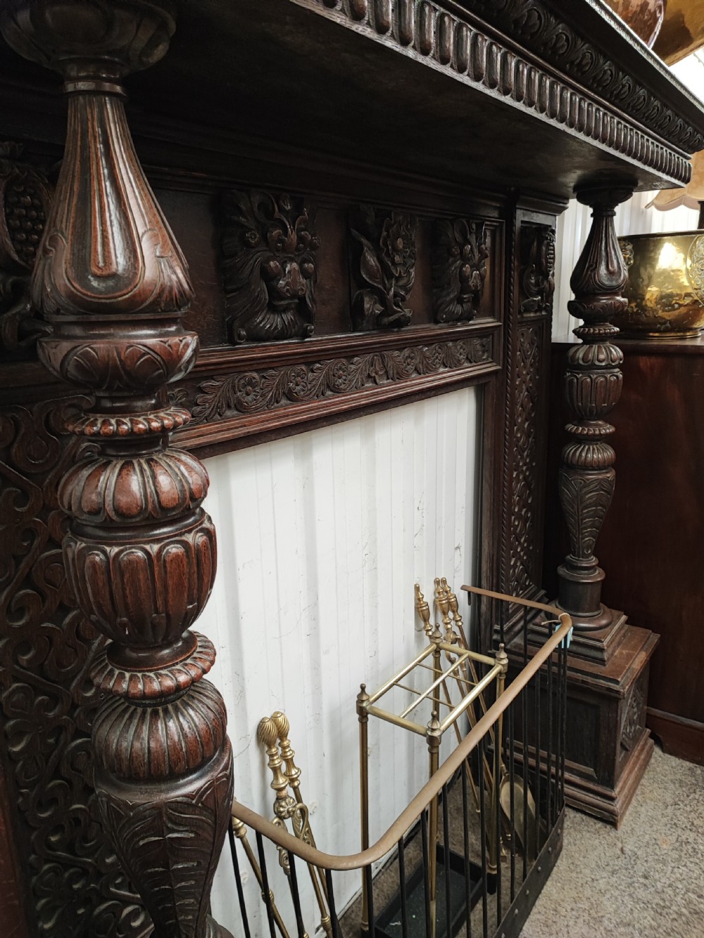 Impressive antique carved oak fire surround. View VII
