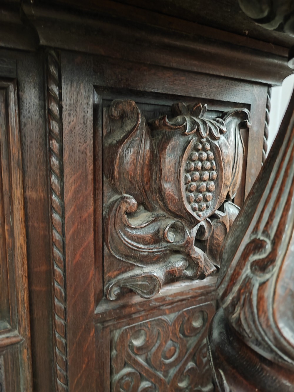 Impressive antique carved oak fire surround. View VIII