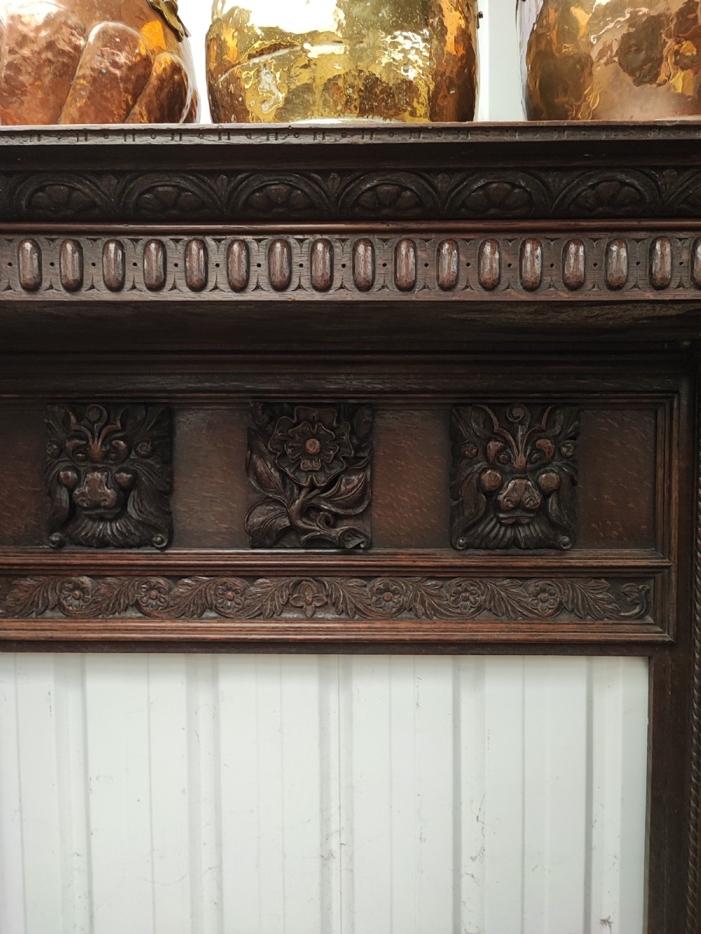Impressive antique carved oak fire surround. View IX