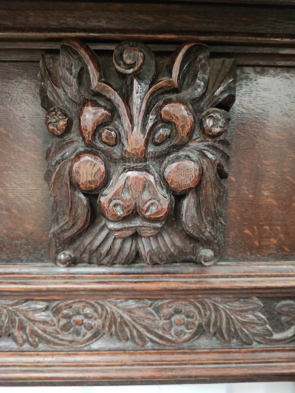Impressive antique carved oak fire surround. View XI