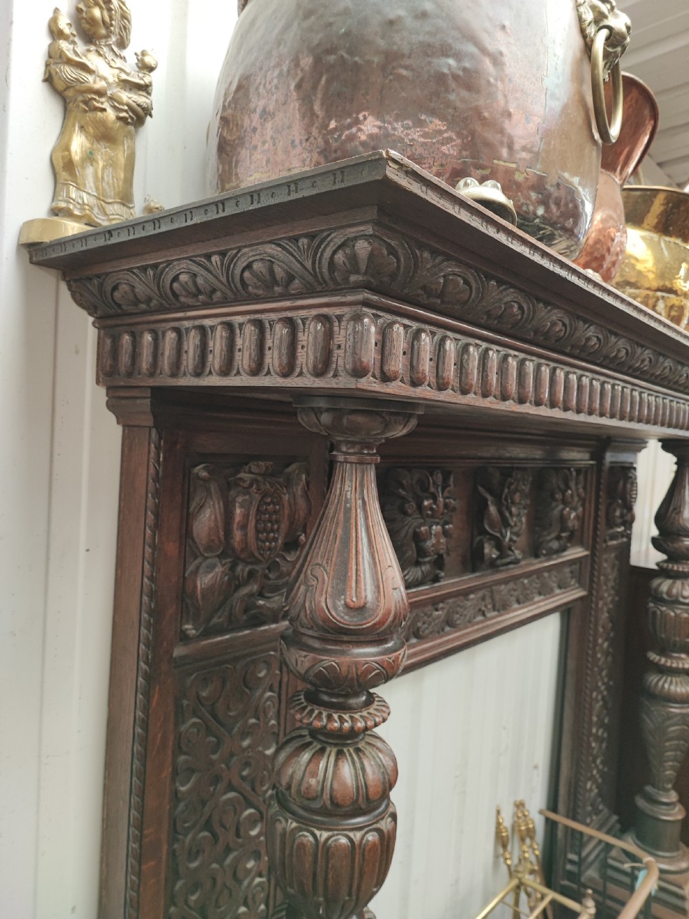 Impressive antique carved oak fire surround. View XV