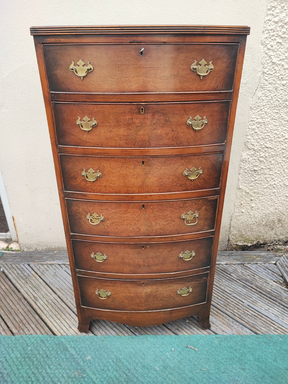 Antique tall walnut chest in the Georgian style.