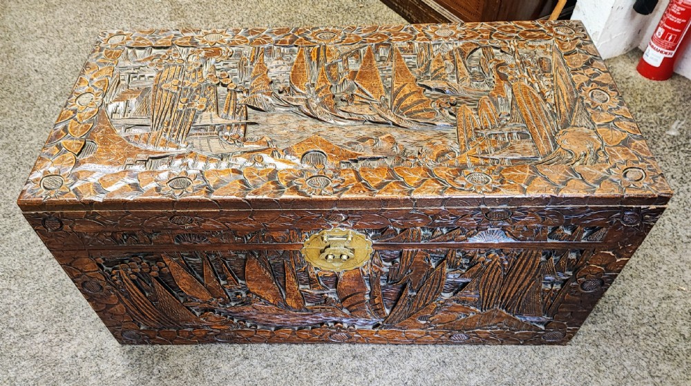 Antique Chinese carved camphor wood trunk.