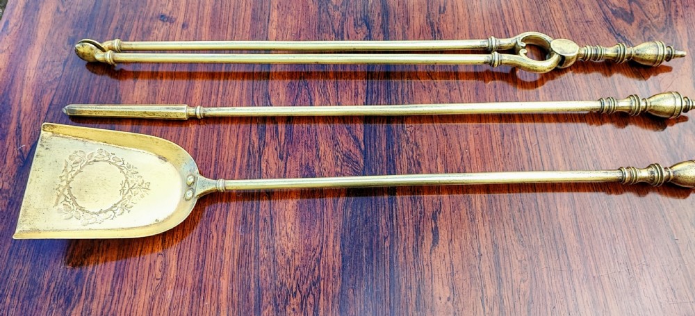 A pretty Georgian set of 3 brass fire irons.