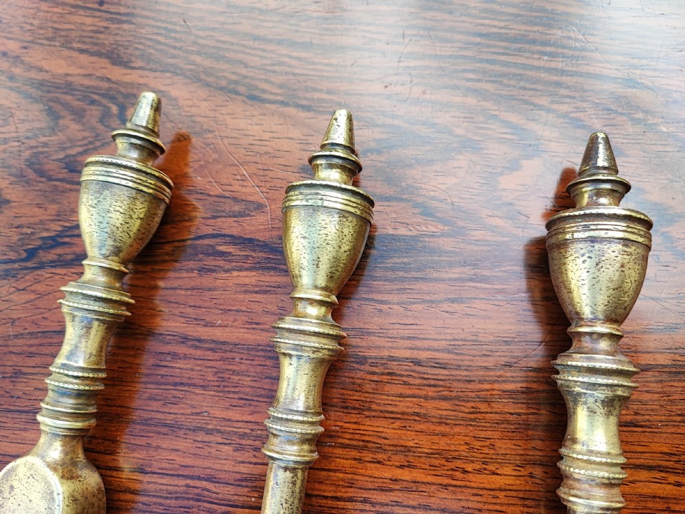 A pretty Georgian set of 3 brass fire irons. View II